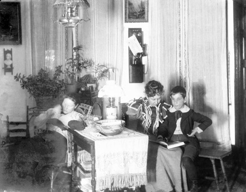 Two women and a boy inside the Crew Home