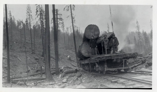 Loggers and Timber on a Flat Bed