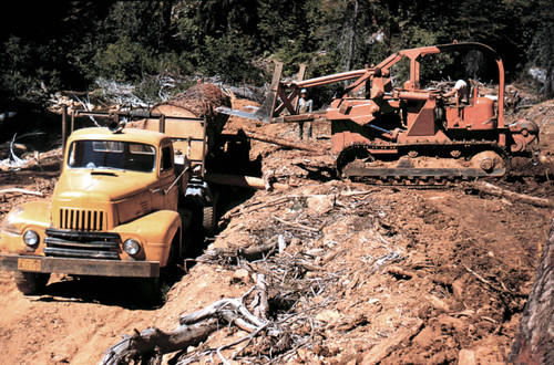 Rolling huge log onto truck--Soper-Wheeler Company
