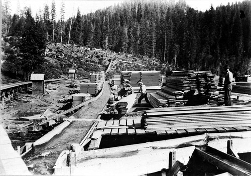 Lumber stacked near flume