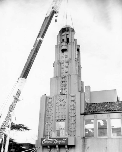 Crane beginning to dismantle tower on Senator Theater building, March, 1999