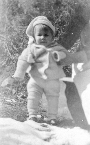 Young child being posed for camera