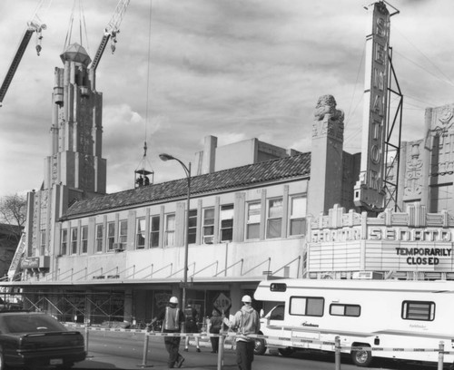 Senator Theater building with crane beginning to dismantle tower, March, 1999