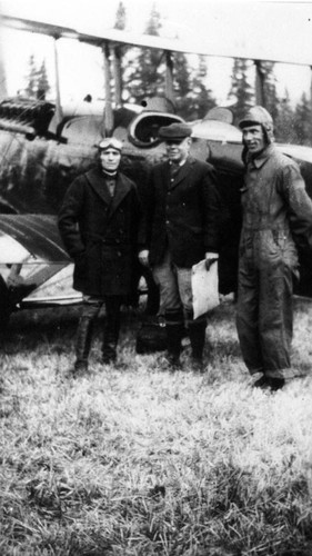 Men in Front of an Airplane