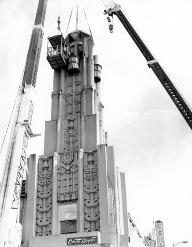 Cranes dismantling tower on Senator Theater building, March, 1999