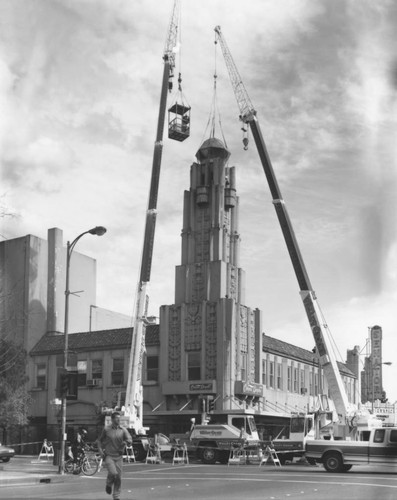 Cranes dismantling tower on Senator Theater building, March, 1999