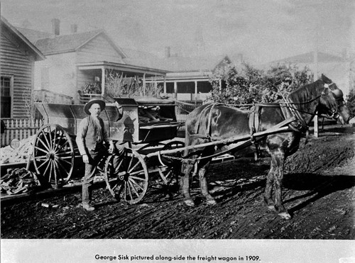 George Sisk Along-side a Freight Wagon