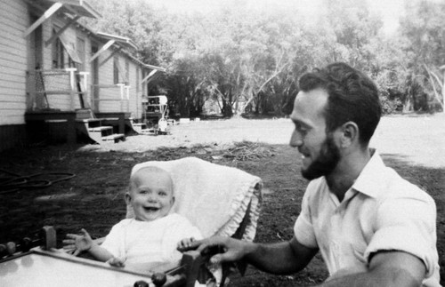 Man and baby at Chico State Vet's Village