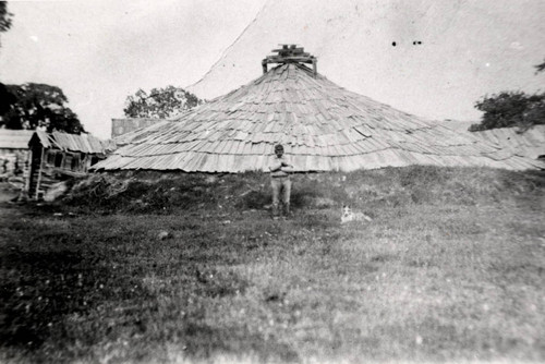 Jim Smith standing in front of round house