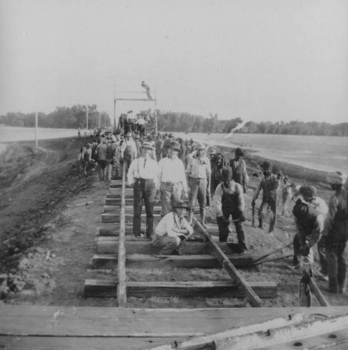 Workers laying railroad tracks for Sacramento Northern for Chico