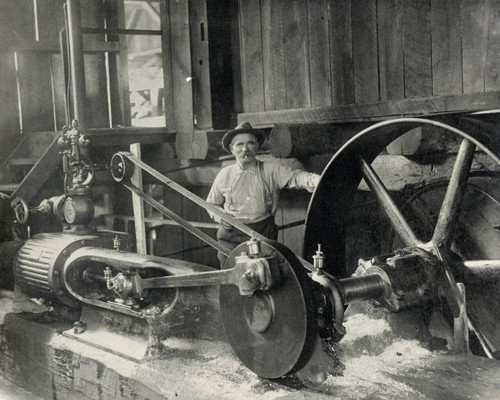 Employee and machinery of Griswold Lumber Company