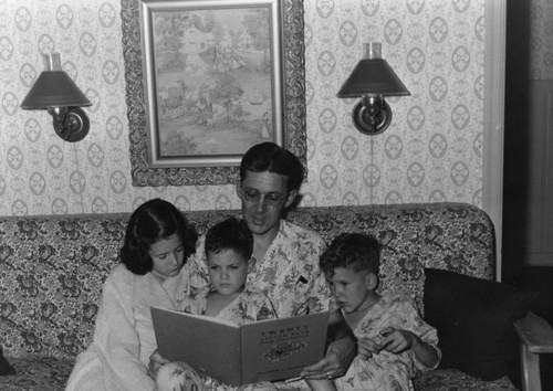 John Nopel reading to his children