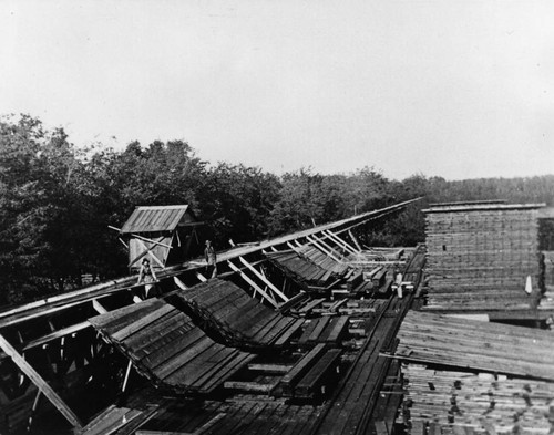 Pulling lumber from a flume