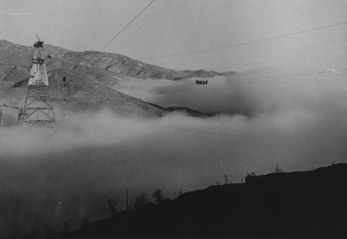 View of Shasta Dam construction site under dense fog