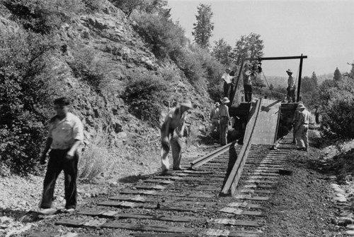 Removing railroad tracks during the construction of Shasta Dam
