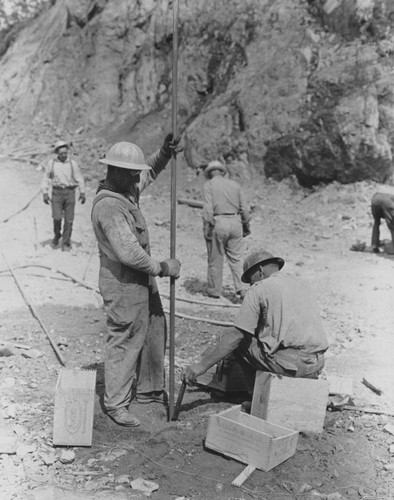 Loading blasting hole, Shasta Dam construction