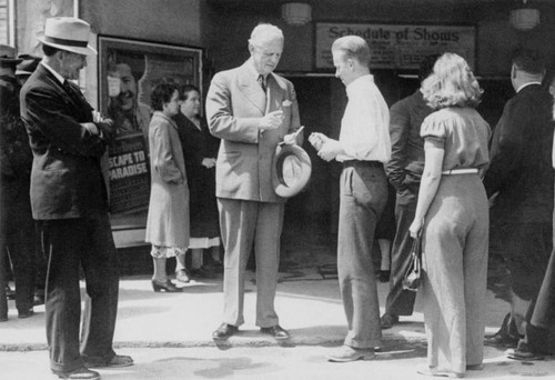 Governor Olson signing autographs during construction of Shasta Dam