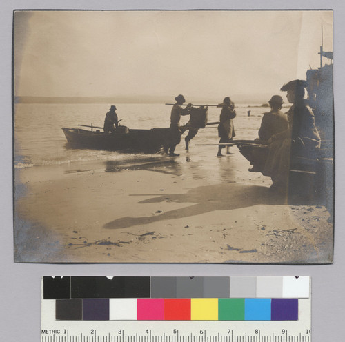 [beach scene: Chinese fisherman landing boat]