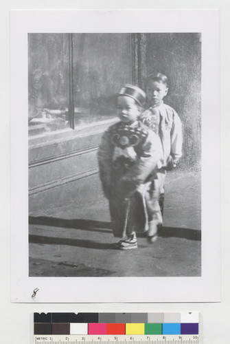 [two boys on sidewalk]