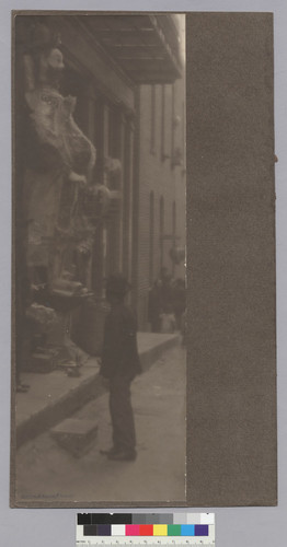 [man standing in front of Joss house entryway, idol]