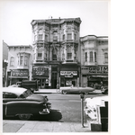 West side of Washington Street between 7th and 8th Streets in downtown Oakland, California. Hersh's Apparel, Grutman's Army and Navy Store in view