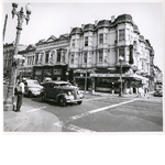 East side of Washington Street between 8th and 9th Streets in downtown Oakland, California. Gelfand's Bargain Store, Mary Lou's Soda Fountain, Daylite Market in view