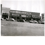 East side of Broadway between 9th and 10th Streets in downtown Oakland, California. Nead's Dairy Lunch, Workingman's Store, United Load Co. in view