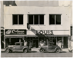 Goldman's building, north side of 12th Street between Broadway and Washington Street in downtown Oakland, California. D.W. Colman Gentlemen's Tailor, Louis Cafe in view