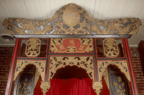 Altar shrine, black background with gold elaborate carving