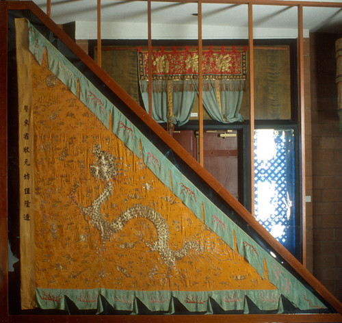 Banner, Parade, triangle, orange silk, dragon, green trim. Chan family