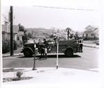 Young boy describes his emergency to members of an unidentified Oakland Fire Department engine company, corner of Park Boulevard and El Centro Avenue, in the Glenview district of Oakland, California