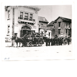 Members of Oakland Fire Department Engine Company 11 pose with a steam engine in front of their fire house at 817 Alice Street in Oakland, California.