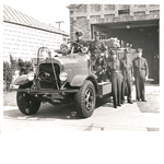 African American members of Oakland Fire Department engine company No. 22 pose with their engine in front of the fire house at 2230 Magnolia Street, Oakland, California