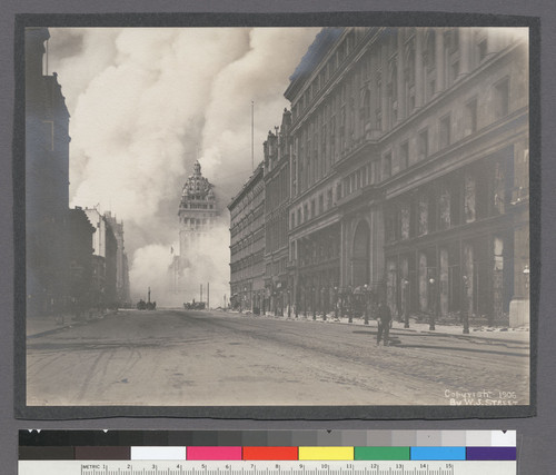 [View along Market St., looking northeast, showing burning of Call Building (right center). Emporium department store at right.]