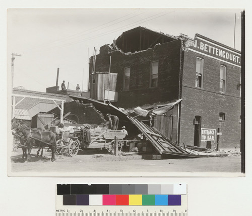 [Reconstruction at [?] J. Bettencourt, grocer. Unidentified location.]