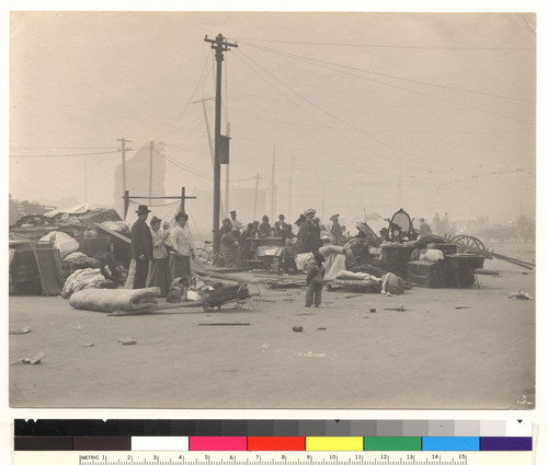 [Refugees with belongings in street. No. 13.]