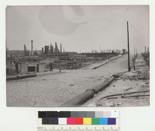 [Pipeline sections along street, unidentified location.]