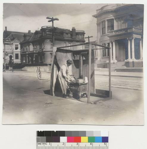 Pacific Avenue. [Woman cooking at street kitchen.]