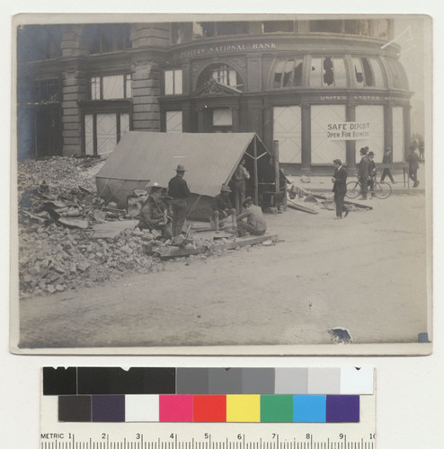 Powell & Mkt. [i.e. Market]. [Soldiers at tent beside Flood Building.]