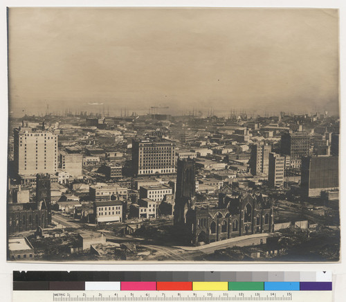 San Francisco, after the fire of 1906. Looking east on California Street. Note clock on Old St. Mary's Cathedral [lower right]. [Merchants' Exchange Building, left; Grace Church, center foreground.]