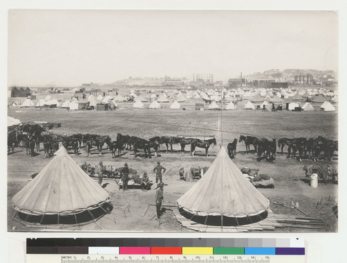 Refugee camp below Fort Mason. [Soldiers posing by tents.]