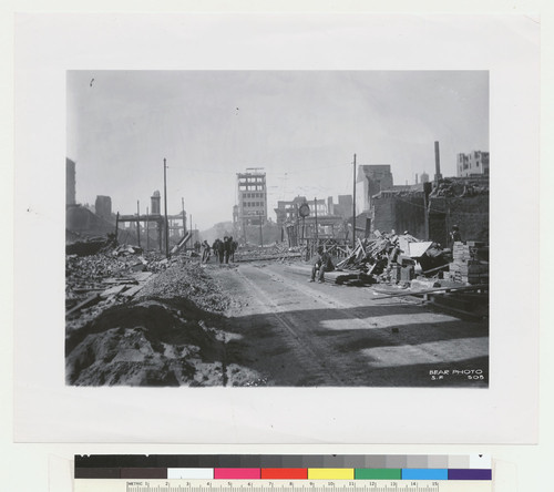 [Street scene showing ruins, rubble and people. No. 508]