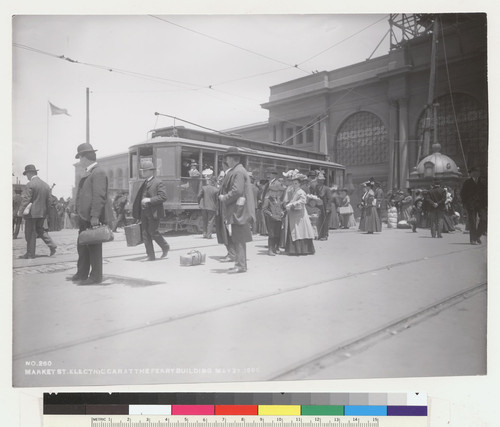 Market St. electric car at the Ferry Building, May 27, 1906. [Accompanying loose capition: "One month after the San Francisco earthquake and fire at the Ferry Building May 27, 1906, showing the new electric cars and derby hats." No. 260.]