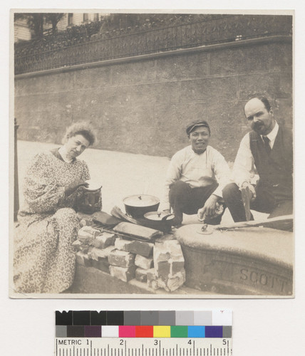 Mrs. D. Louderback[?]. Earthquake scene. [Woman and two men at street kitchen. Chinese (?) man cooking, center.]