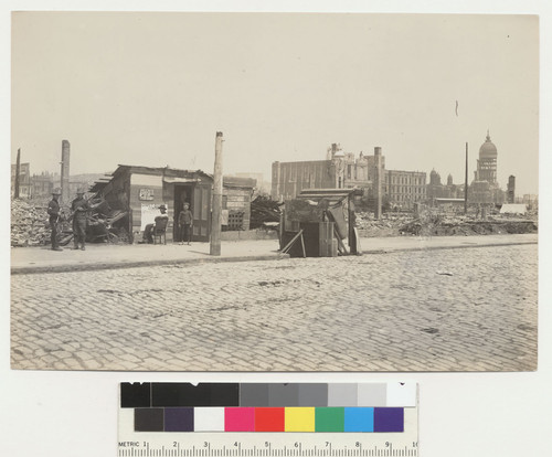 Polk St. [?], Market to Fell. [Soldiers and staff posing at makeshift carpet cleaning company office.]