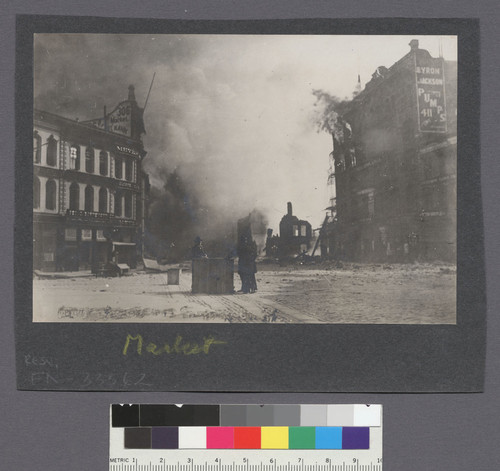 Market. [Men in street, watching fire.]