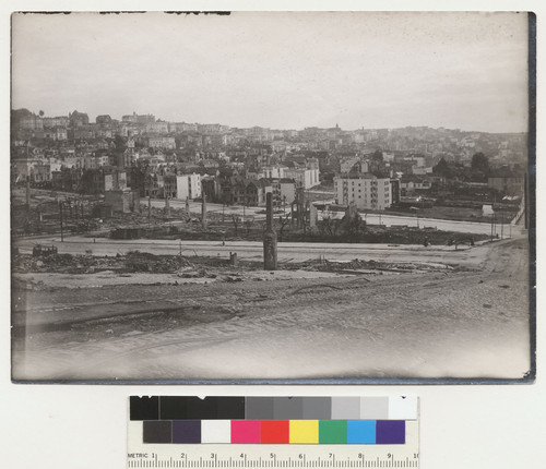 Polk at Union. Shows Van Ness with one side of street destroyed by dynamiting. Presidio Heights in distance. [View continues on FN-27670.]