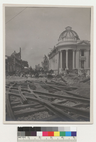 [Temporary railroad tracks under construction in front of Hibernia Bank. Market St. at McAllister and Jones.]