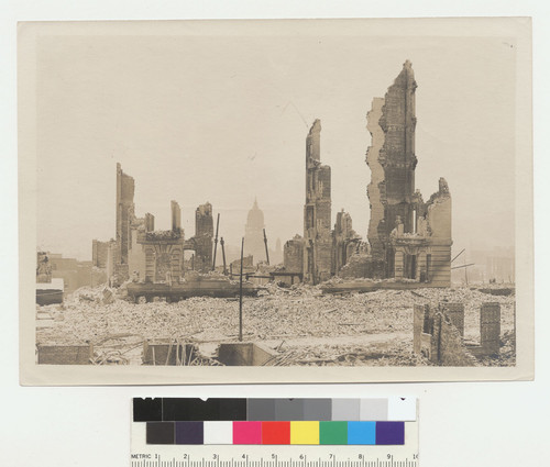 [Ruins, unidentified location. Dome of City Hall in distance, center.]