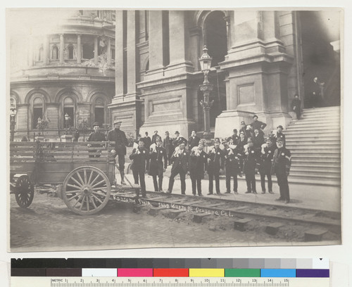 [Police posing with bags in front of City Hall.]